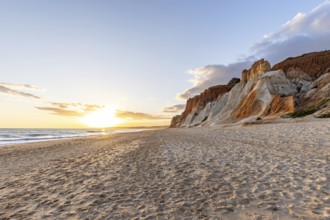 Incredible rock formations by the sea. Red cliffs with red earth and breathtaking formations on the