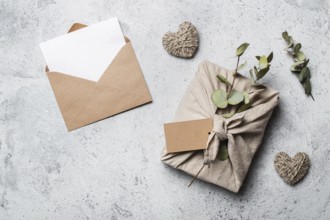 Zero waste Valentine's Day concept and mock up. Eco-friendly gift cloth wrapping in Furoshiki
