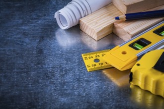 Composition of construction working tools on metallic scratched background architecture and