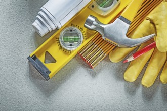 Collection of construction tools on concrete background building concept
