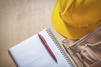 Composition of construction equipment on wooden board