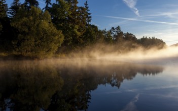 Lake with morning fog Light mood
