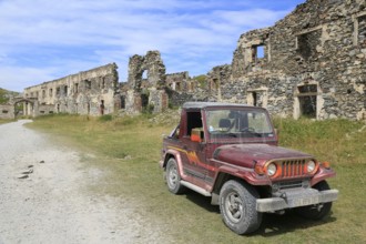 Asia Rocsta off-road vehicle in the ruins of the former barracks at Col de Tende, Alpes-Maritimes