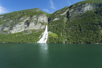 Image shows a waterfall in Geiranger ford in norway