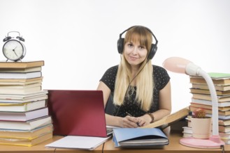 Student with headphones ready to pass the diploma project looked into the frame