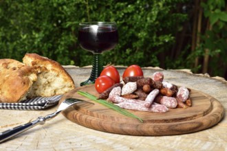 A picnic with salami and red wine
