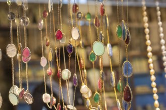 Handcrafted necklace. String of beads in various colors. Colorful beads necklaces