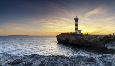 A view of the lighthouse at Colonia Sant Jordi in Mallorca at sunset