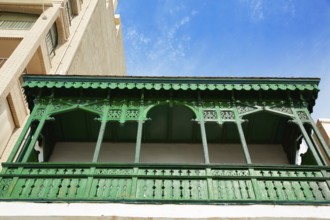 Burriana facades in Castellon of Spain green balconade