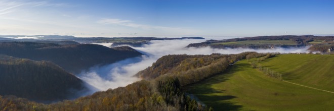 Thick fog fills the valleys in autumn