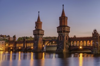 The beautiful Oberbaum Bridge over the Spree in Berlin at dusk