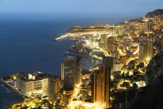 Monte Carlo panorama illuminated by night. Urban landscape with luxury architecture