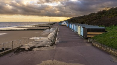 Beach huts on the North Sea coast at Frinton-on-Sea, Essex, England, UK