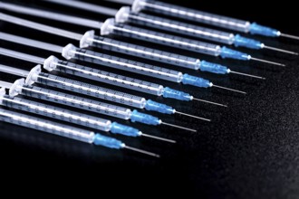 Medical Syringes Needle on Black Background, Close up Syringe, Health care concept