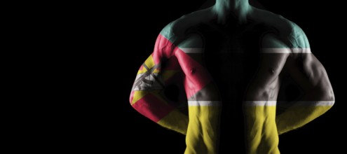 Mozambique flag on muscled male torso with abs, black background