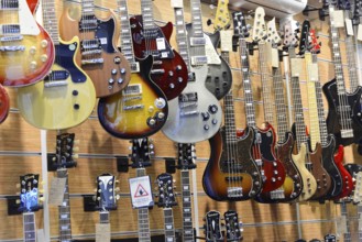 A music shop with a variety of hanging electric guitars in different designs, Istanbul, Istanbul