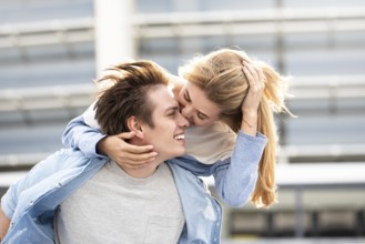 Happy to spending time together. Young beautiful couple outdoor fashion portrait. Attractive boy