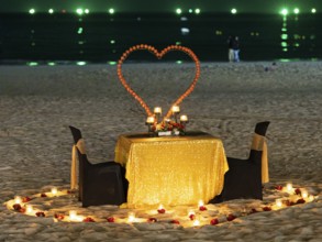Table and chairs, illuminated and decorated, romantic, Chenang Beach, Langkawi, Kedah State,