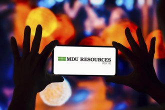 In this photo illustration, the MDU Resources Group logo is displayed on a smartphone screen