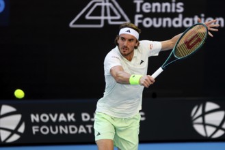 MELBOURNE, AUSTRALIA, JANUARY 11: Stefanos Tsitsipas of Greece plays against Novak Djokovic of