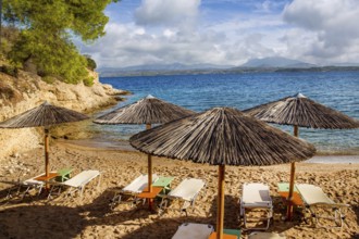 Greek island Spetses, beach with awnings, Idyllic place for recreation, not so noisy as Mykonos.