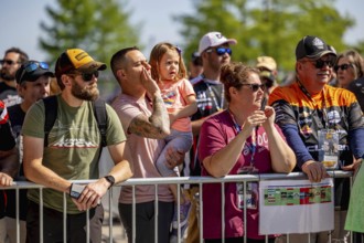 Fans watch all the race action during the Indianapolis 500 at the Indianapolis Motor Speedway in