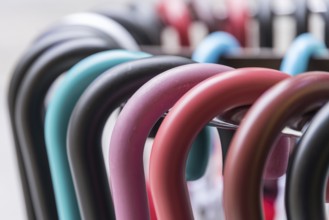 Colourful handles of parasols and umbrellas - close-up