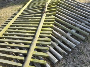Old and broken wooden fence panels