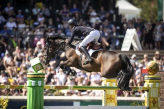Steve Guerdat of Switzerland and riding Venard de Cerisy compete in the first round of the 1.60m