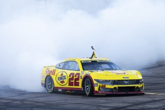JOEY LOGANO (22) of Middletown, CT celebrates with his team after winning the NASCAR Cup Series