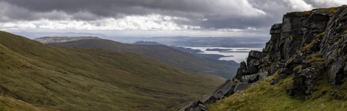 Rocks at the summit and views of Loch Lomond and the Loch Lomond and the Trossachs National Park