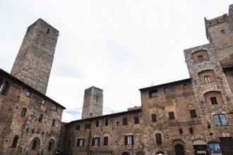 Low angle view of the medieval buildings and a bell tower of a small village in the mountains in