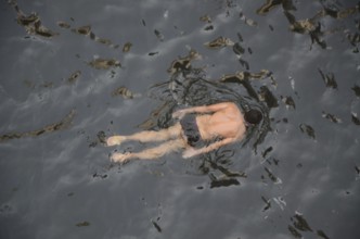 Man swimming in stepwell, jodhpur, rajasthan, India, Asia