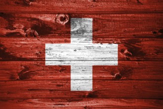 Switzerland flag on wooden planks background wood flag