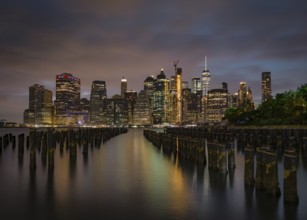 The Manhattan skyline as seen from Brooklyn at night. New York, USA, North America