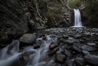 Waterfall splashing and flowing through stones on the river. Machairas forest Troodos mountains