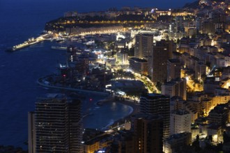 Monte Carlo panorama illuminated by night. Urban landscape with luxury architecture