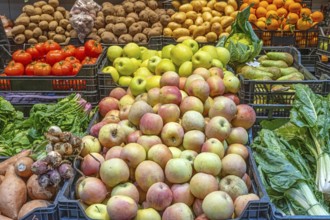 Apples and vegetables for sale at a market