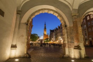 View of the old town of Gdansk with the Main Town Hall through the arch of Green Gate, Poland,