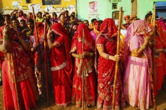 Women with sticks, Lathmar Holi festival, Mathura, Uttar Pradesh, India, Asia