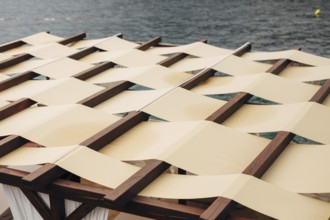 Unusual roof closure. The roof of the restaurant on the street by the sea. The fabric roof. SUMMER