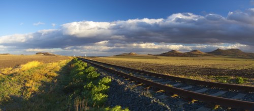 Single railway track at sunset, Central Bohemian Uplands, Czech Republic. Railway track in nature