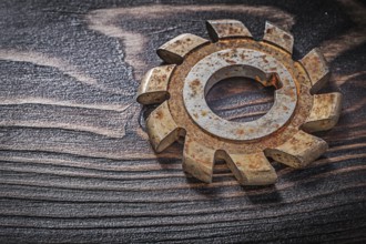 Rusted milling cutter on vintage wooden board construction concept