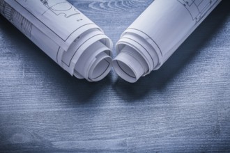 View on two white rolls of blueprints