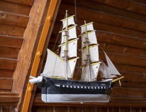 Votive ship named Glaube in the Schifferkirche church in Ahrenshoop on the Fischland-Darß-Zingst