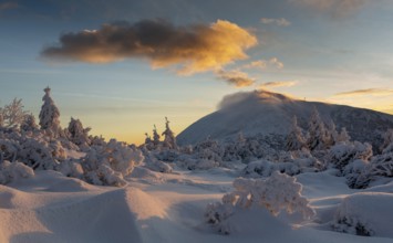 Sniezka peak in winter at sunrise. Karkonosze National Park, Poland, Europe
