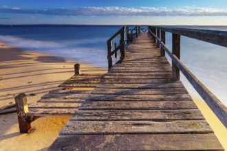 Piers near Millionaire's Walk at Point King Beach on a cool winter's morning at sunrise on the