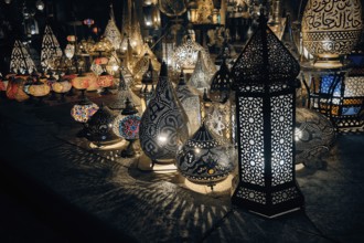 Glowing arabic lamps for sale in front of egyptian souvenir shop. Traditional middle eastern