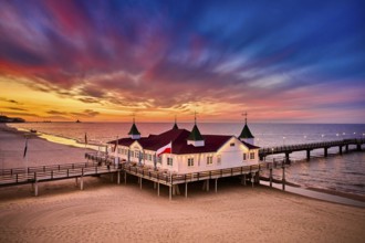 Morning time at baltic sea beach and sight Ahlbeck pier in sunrise