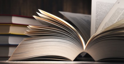 Composition with open book on the table
